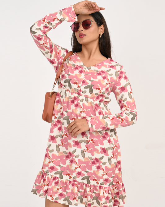 “Pink floral rayon dress – front view long sleeve ruffle hem”