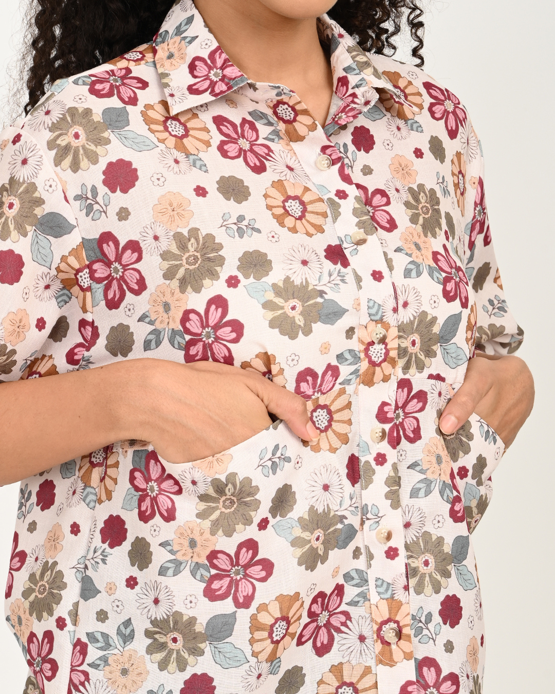 👉 Close-up of floral cotton fabric and pocket design on cream maroon top – The Classy Clothing.