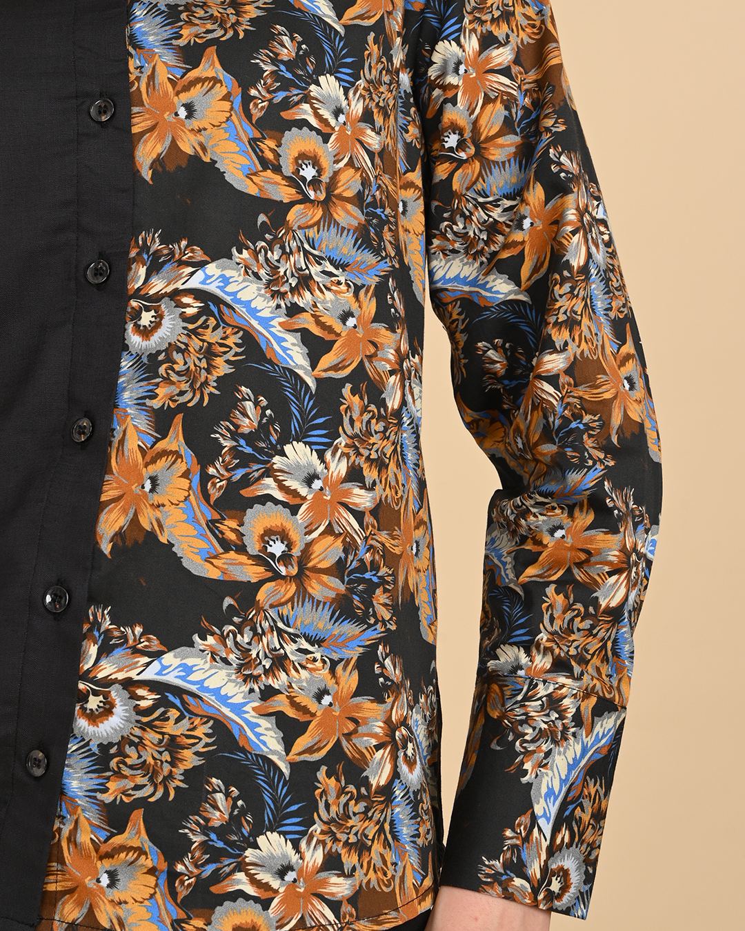 Close-up detail of the half black solid and floral printed women's shirt showing high-quality rayon cotton texture and button finish.