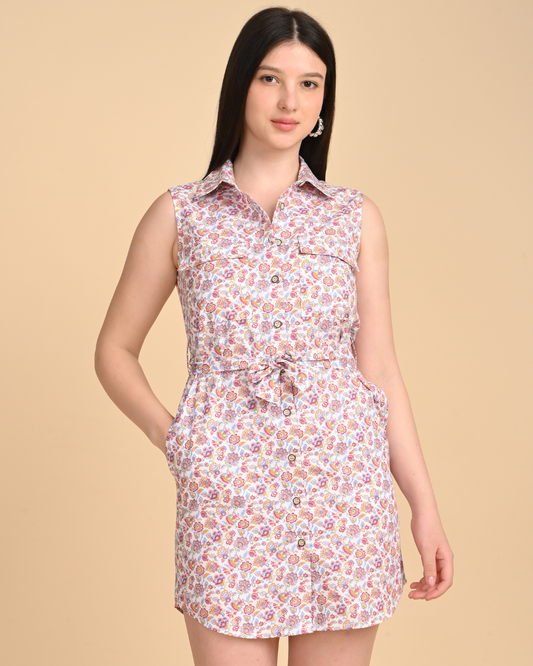 Woman wearing a floral printed cotton sleeveless dress for summer on a beige background