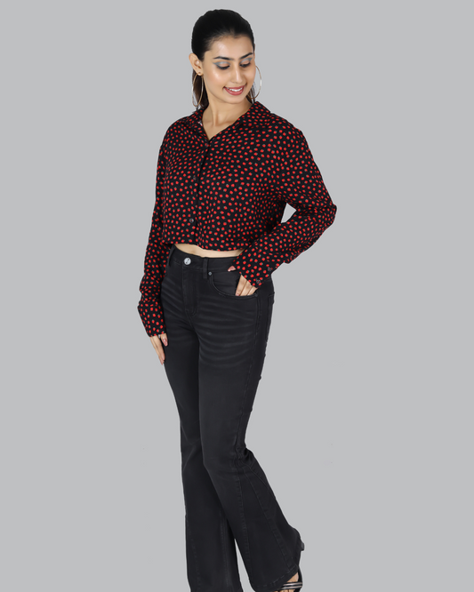 Woman wearing a printed long sleeve viscose crop top in maroon from The Classy Clothing.