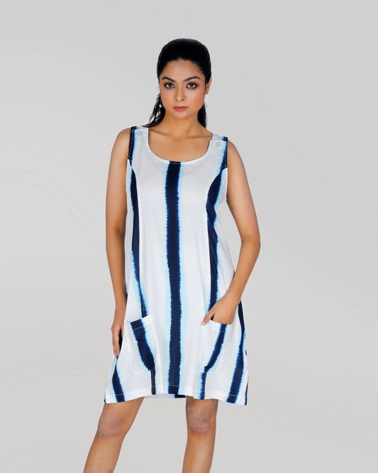 "Woman wearing a sleeveless blue and white tie-dye dress – front view styling reference."