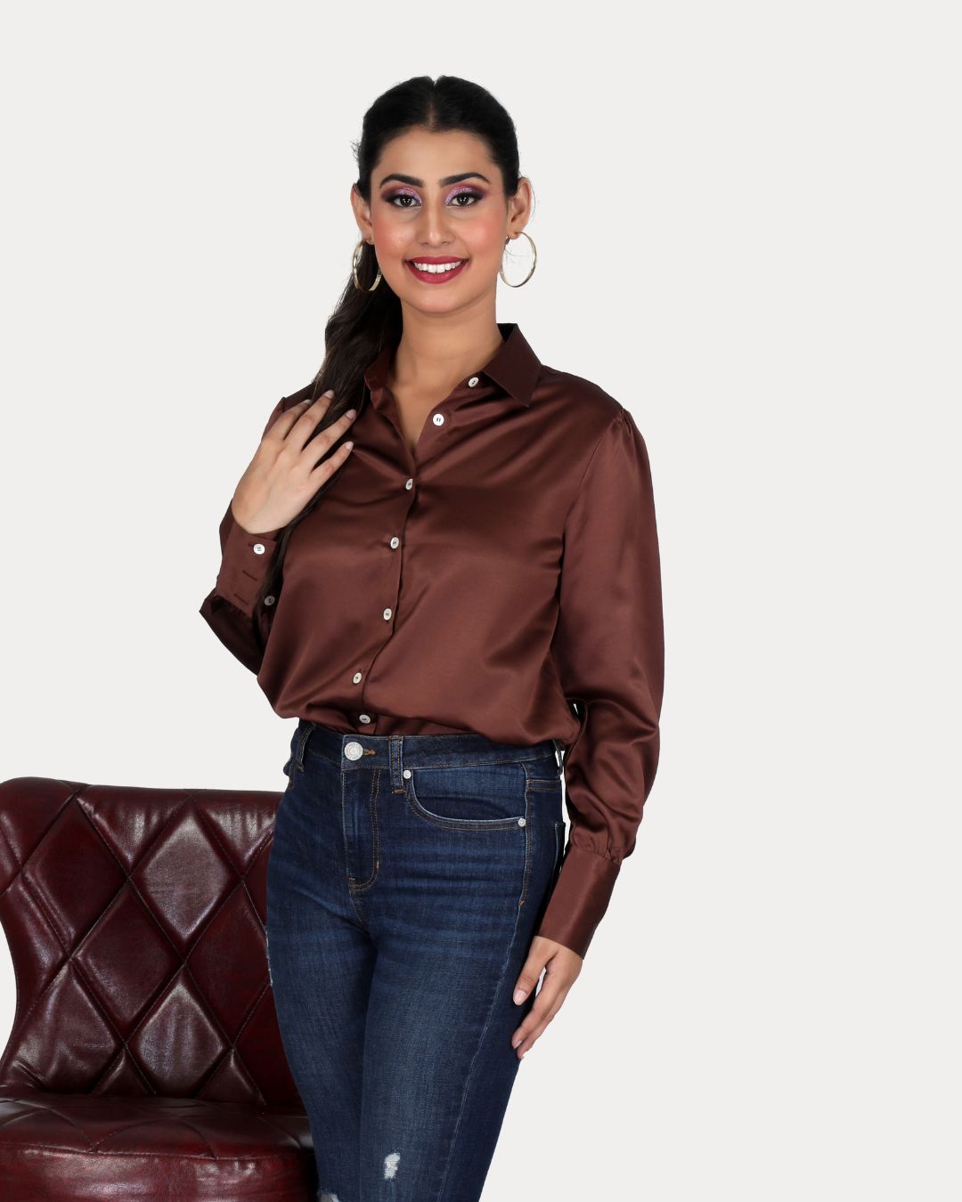 Woman wearing a brown satin shirt paired with blue jeans – premium satin shirt for women