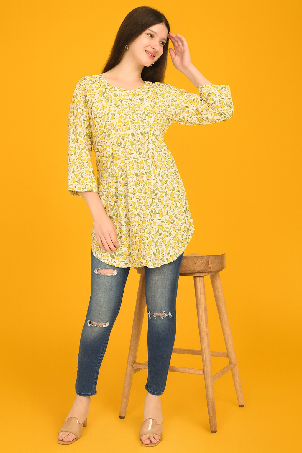 Woman wearing yellow cotton printed top styled for work and casual wear