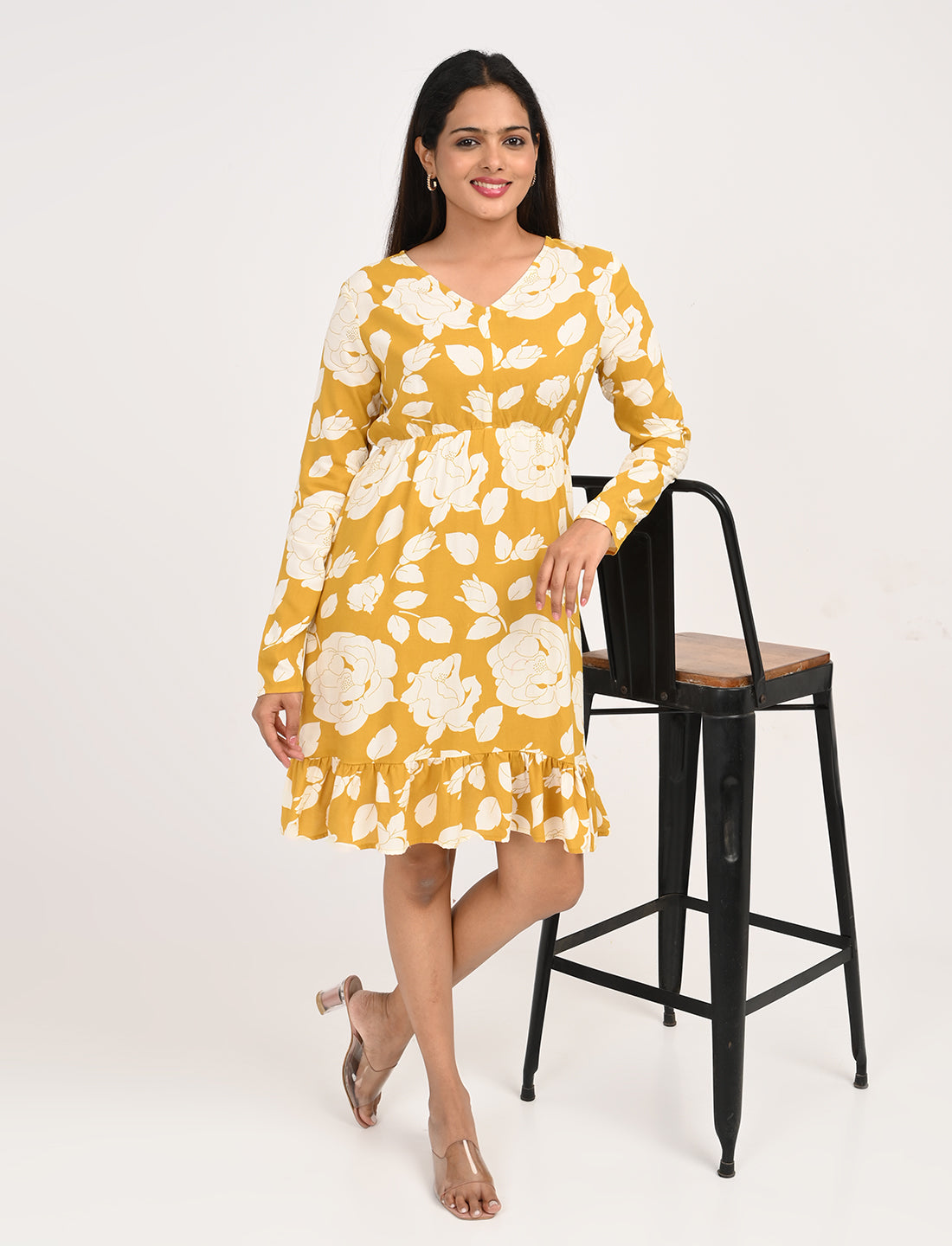 Woman wearing yellow floral dress styled for brunch and casual outings