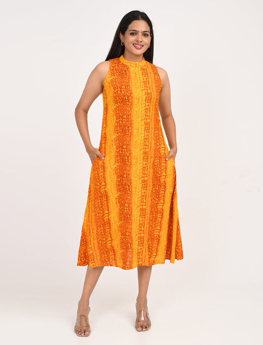 Woman wearing orange rayon sleeveless midi dress for summer brunch in India