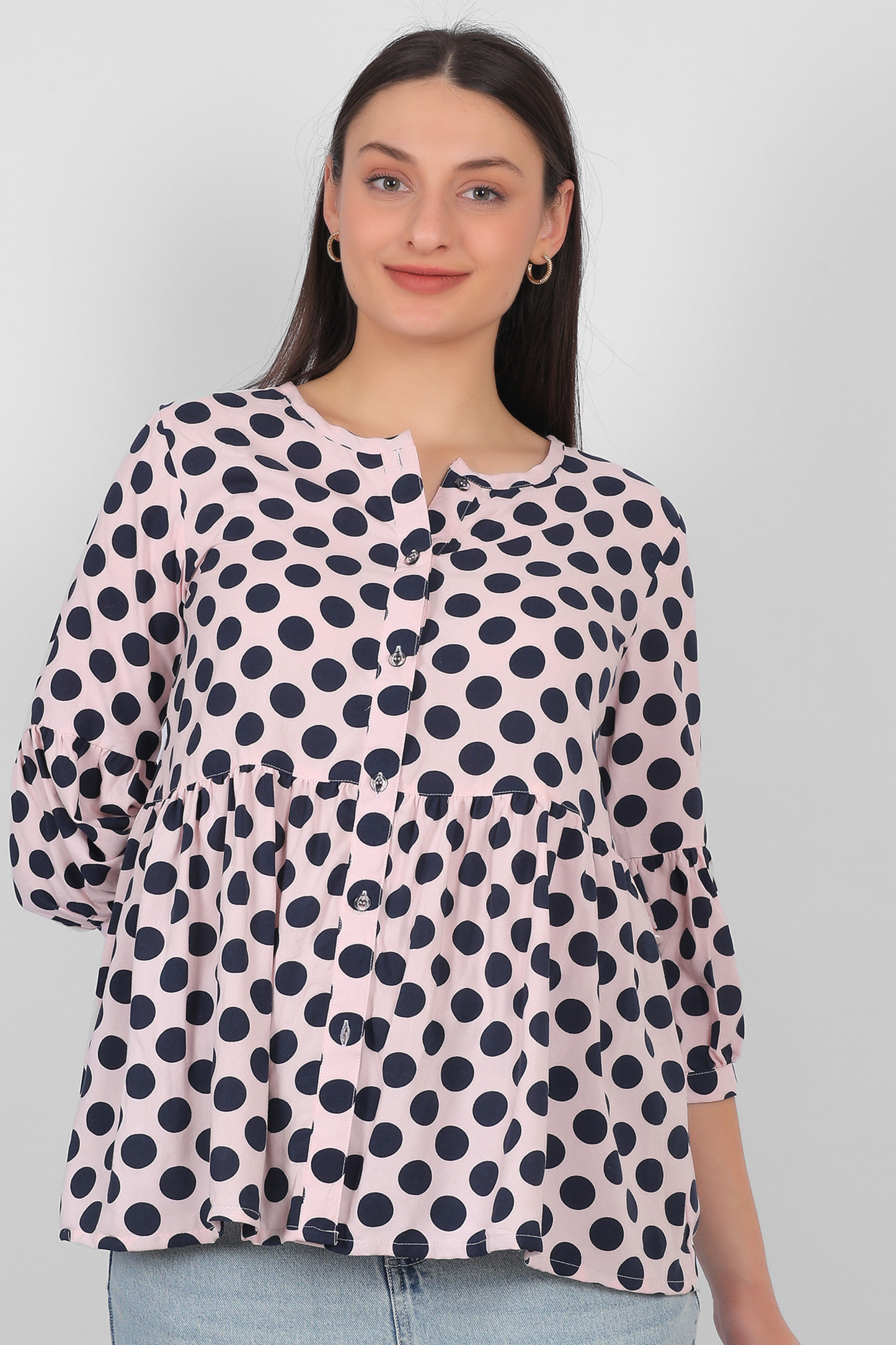 Peach rayon top for women shown from front with button detailing and three quarter sleeves