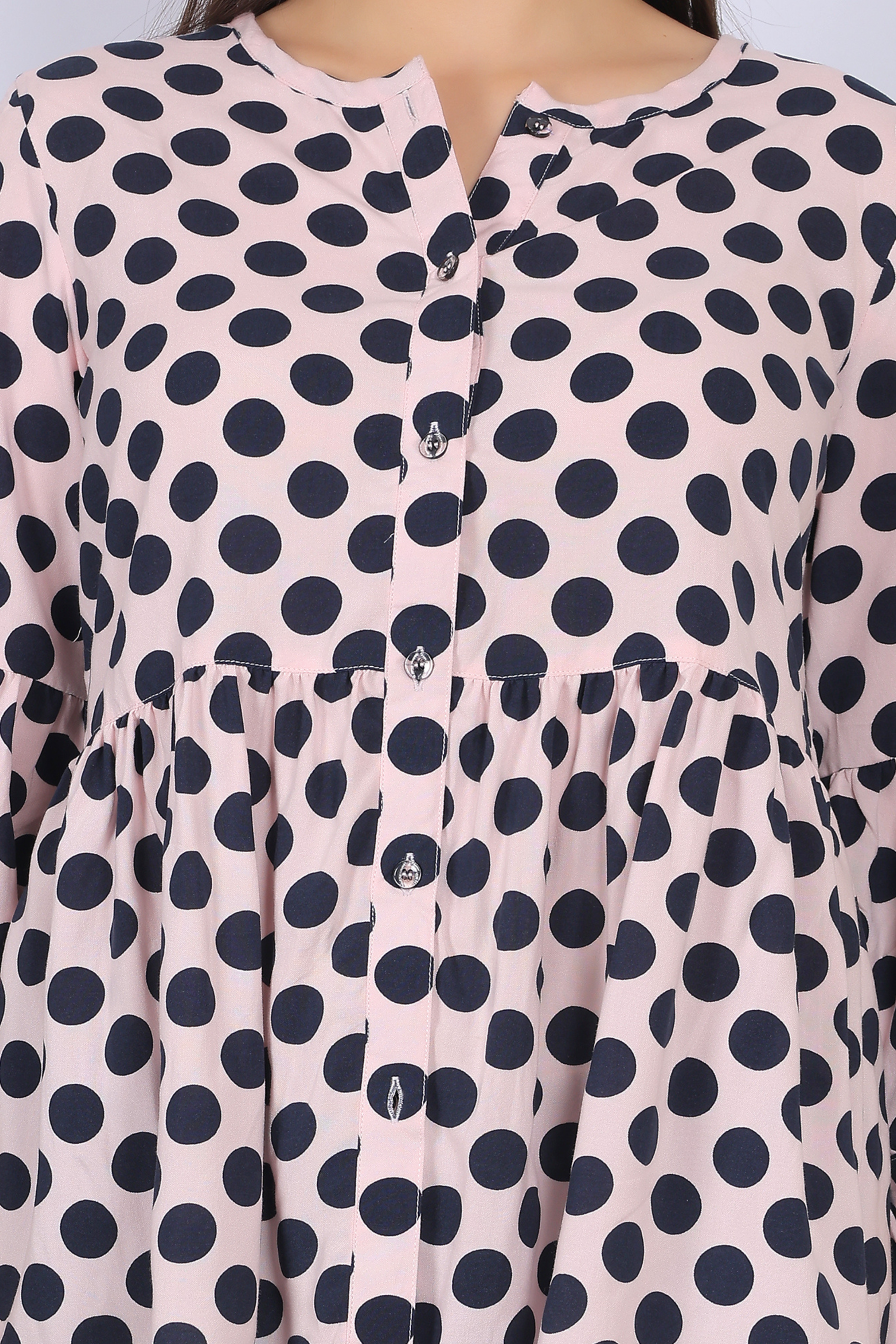 Peach rayon top for women close up view of neckline and button detailing