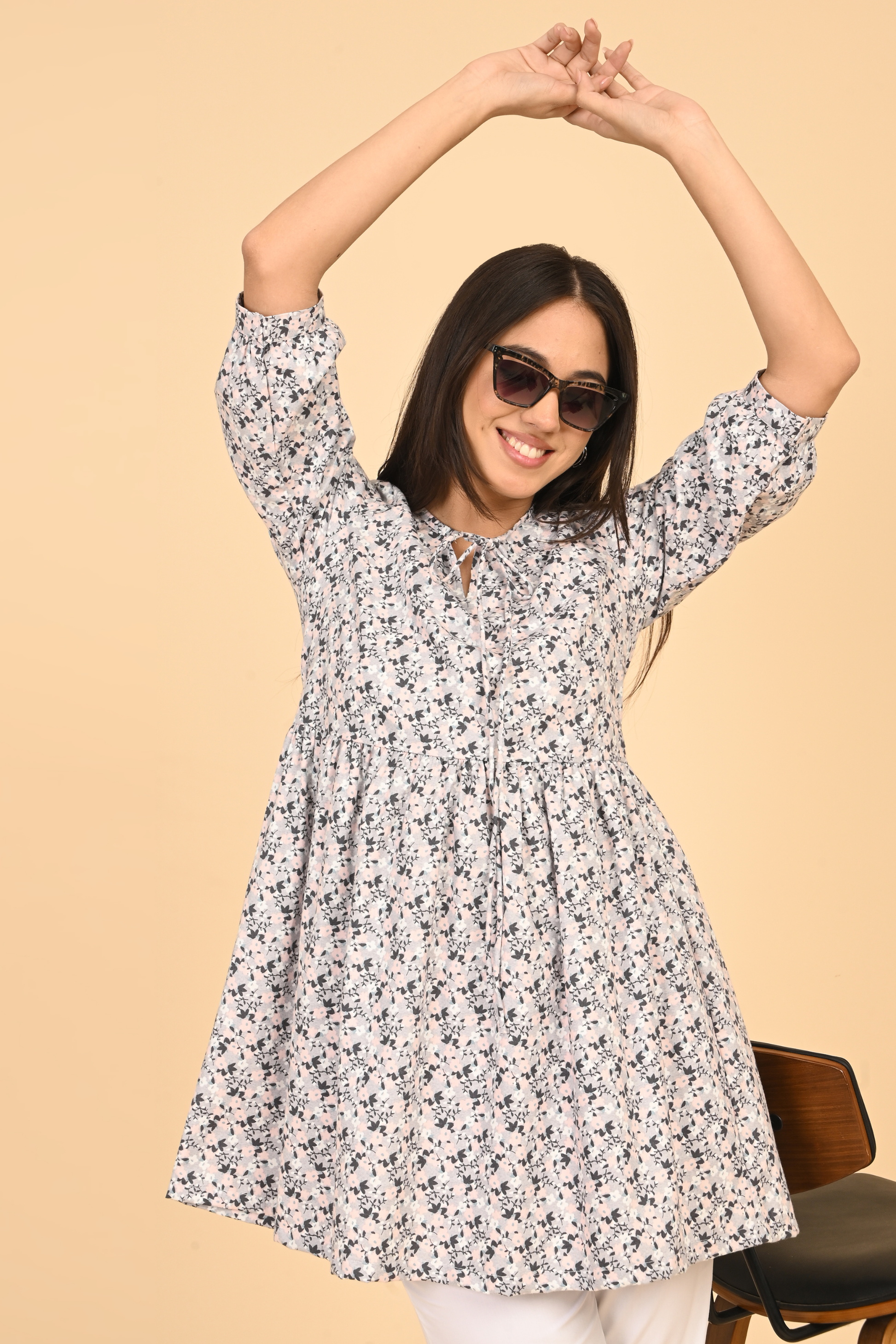 Women wearing all over printed rayon dress for summer wear in India