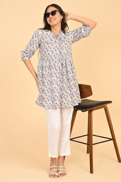 Women posing in all over printed rayon dress for summer wear in India