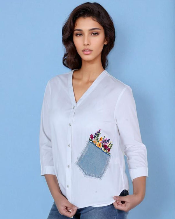 Woman wearing white cotton embroidered pocket shirt – stylish office and casual wear”