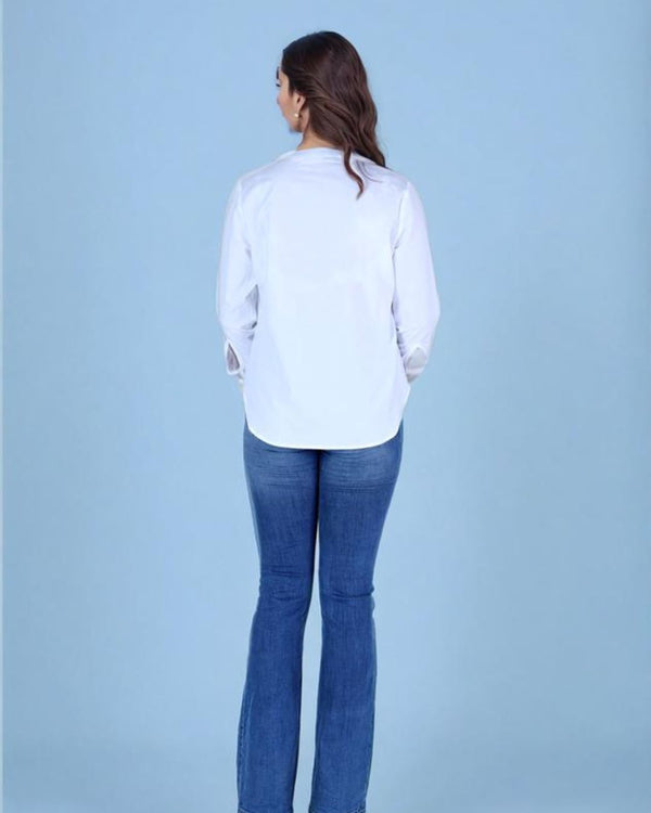 “Back view of women’s white 100% cotton embroidered shirt”