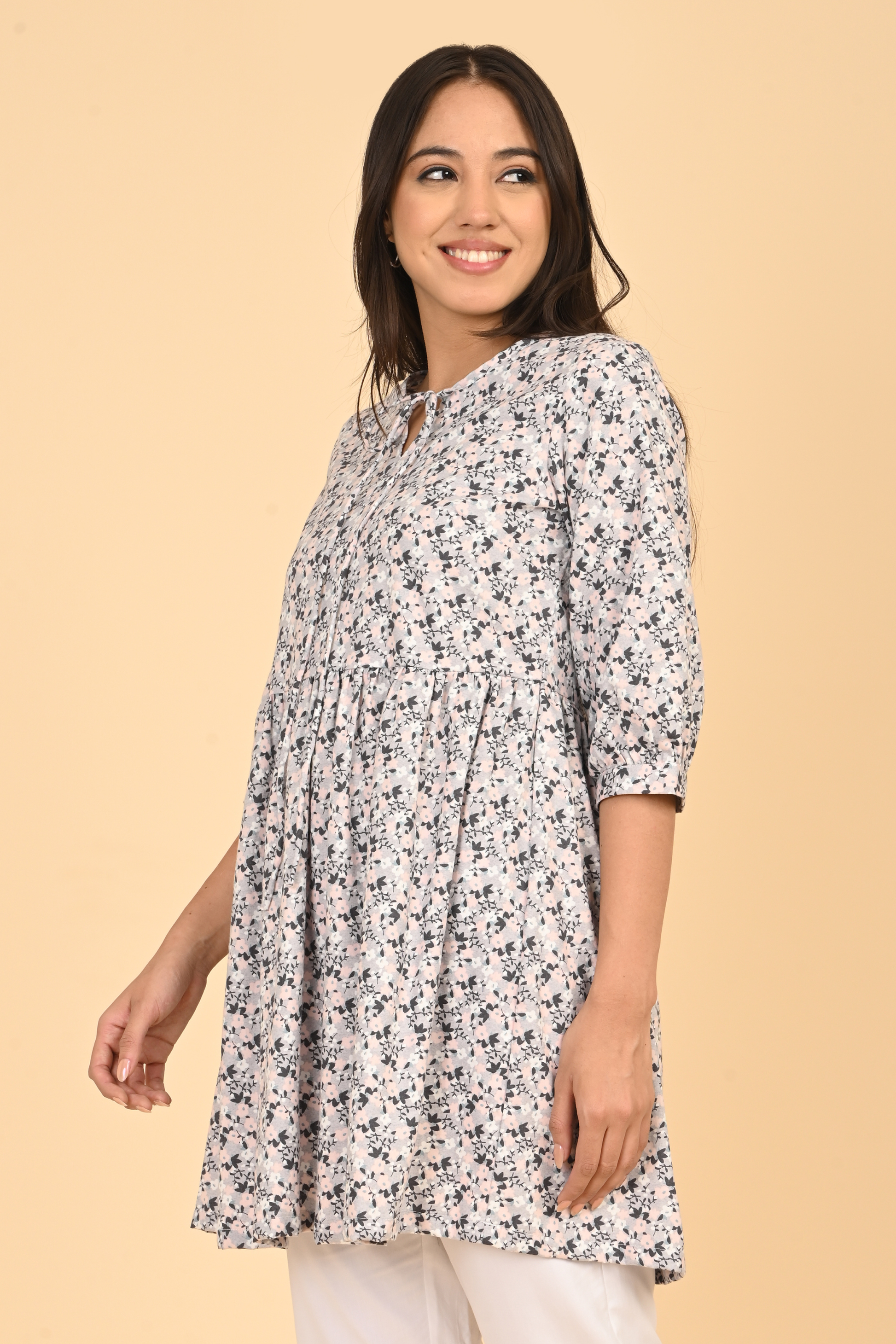 Women standing in all over printed rayon dress for summer wear in India