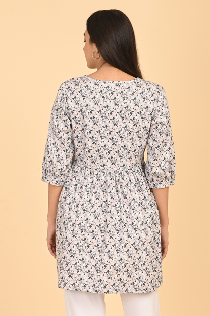 Back view of women wearing all over printed rayon dress for summer wear in India