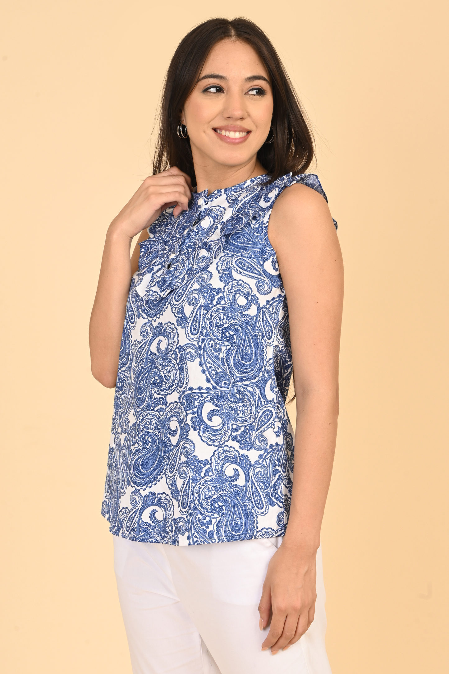 Women posing in all over printed rayon sleeveless top for summer wear in India