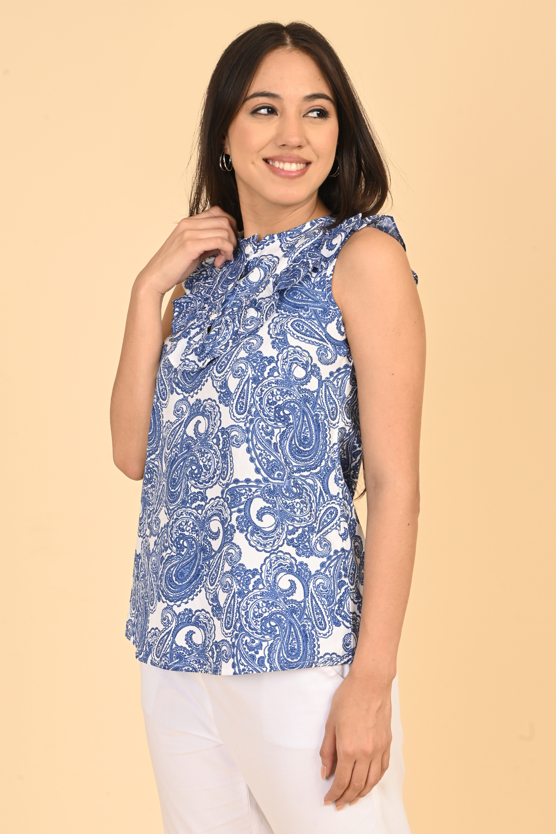 Women posing in all over printed rayon sleeveless top for summer wear in India