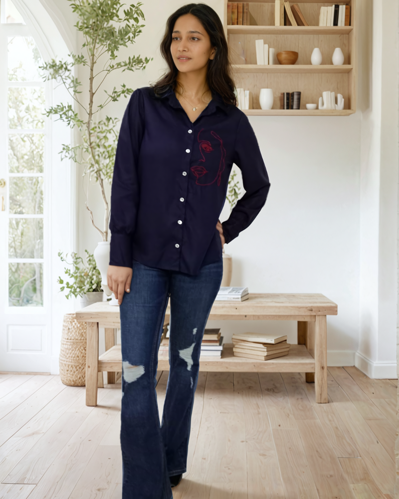 Woman wearing navy blue embroidered cotton long sleeve shirt