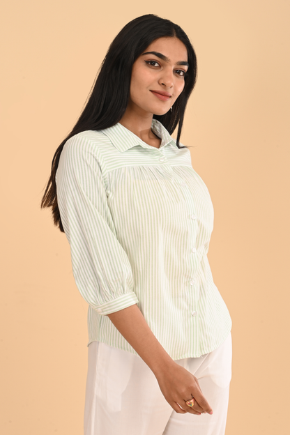 Three-quarter view of cotton striped yarn dyed top for women in light green
