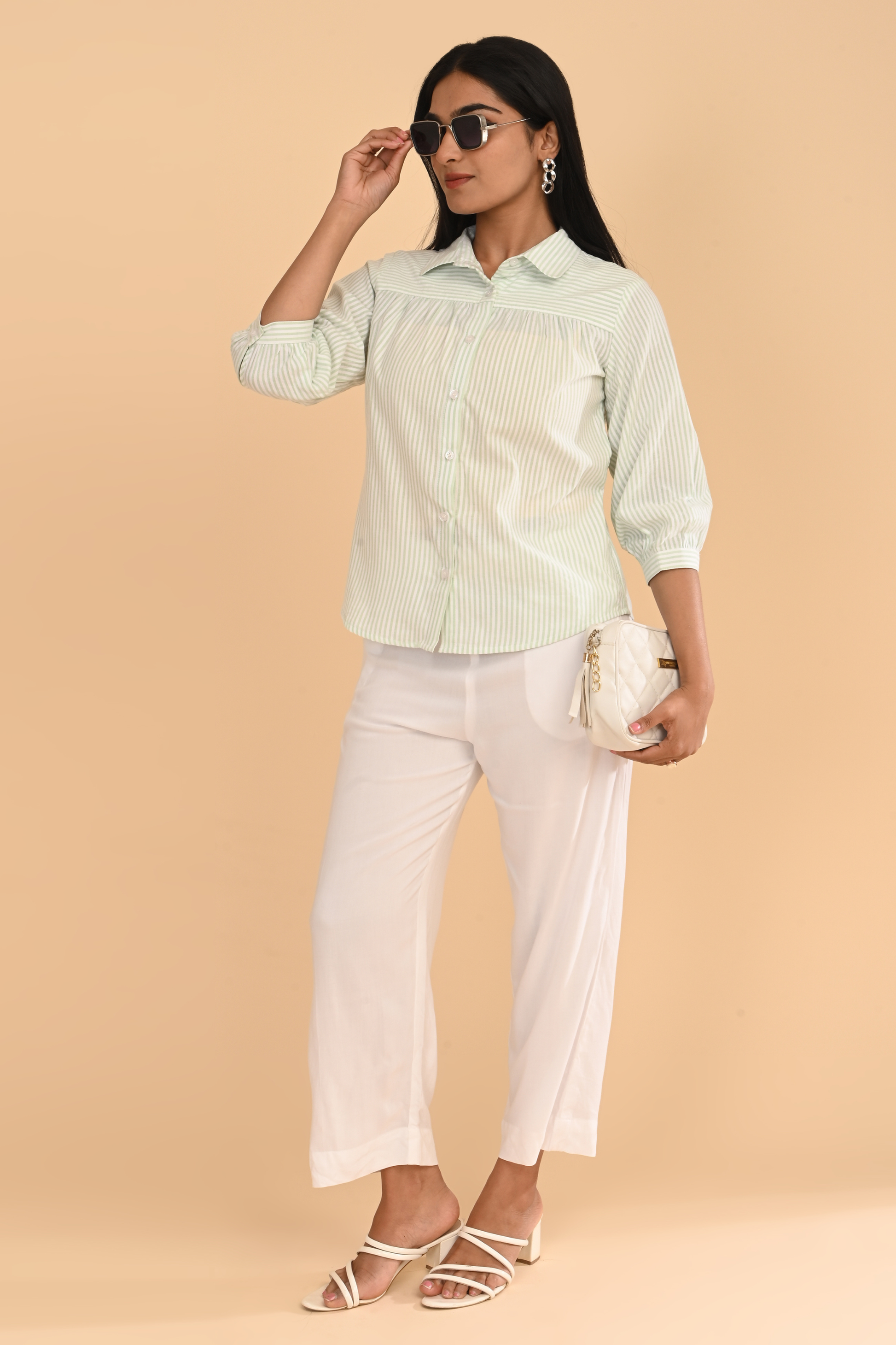 Full-length view of cotton striped yarn dyed top for women in light green, paired with white pants