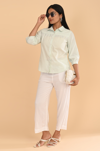 Full-length view of cotton striped yarn dyed top for women in light green, paired with white pants
