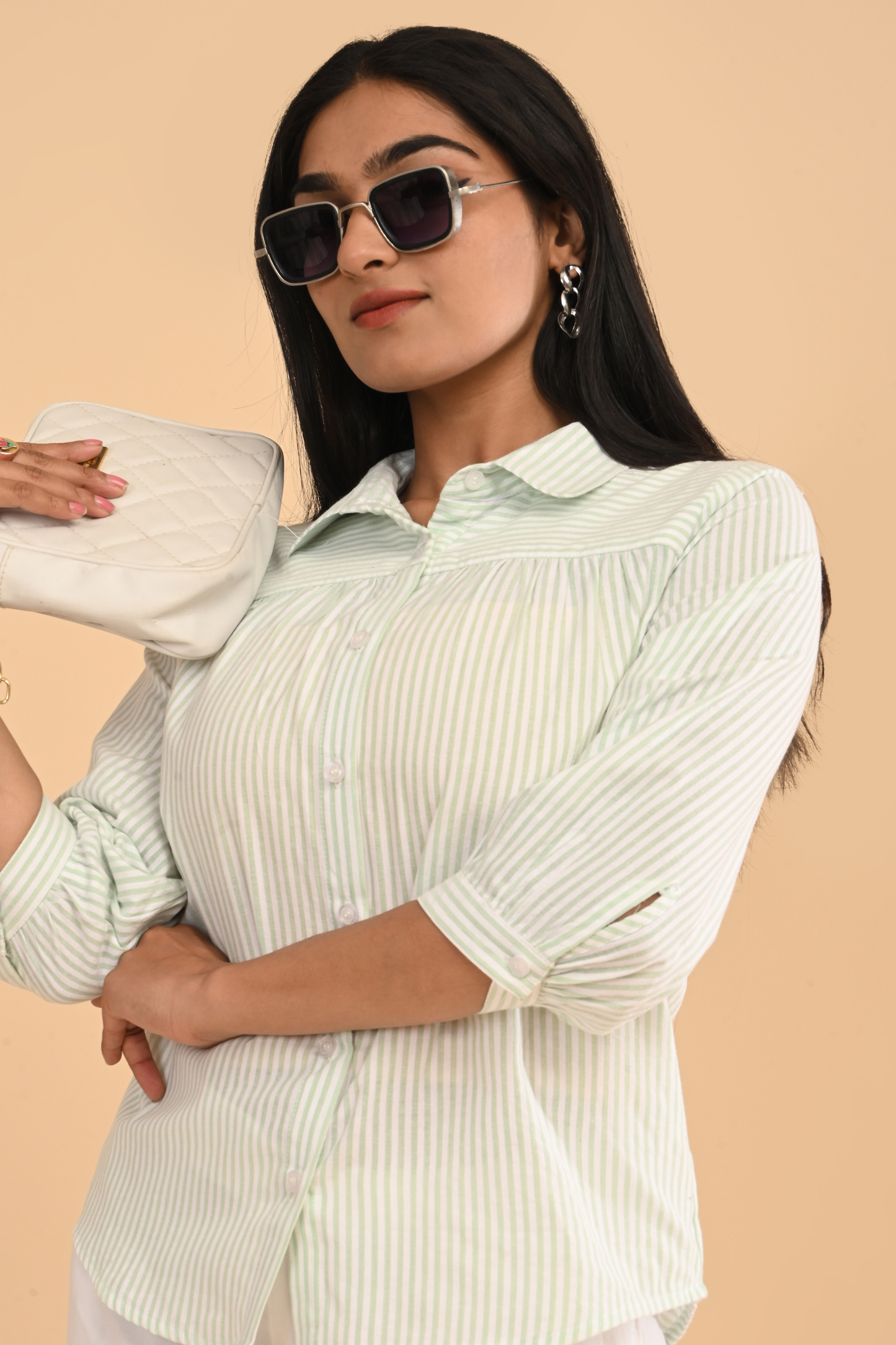 Upper-body view of cotton striped yarn dyed top for women in light green