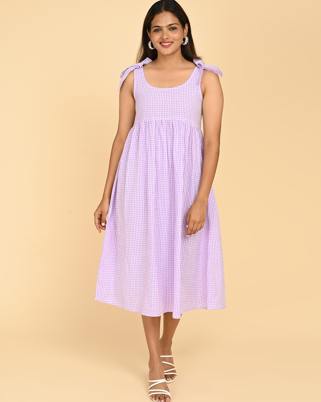 woman wearing cotton check midi dress for women in india