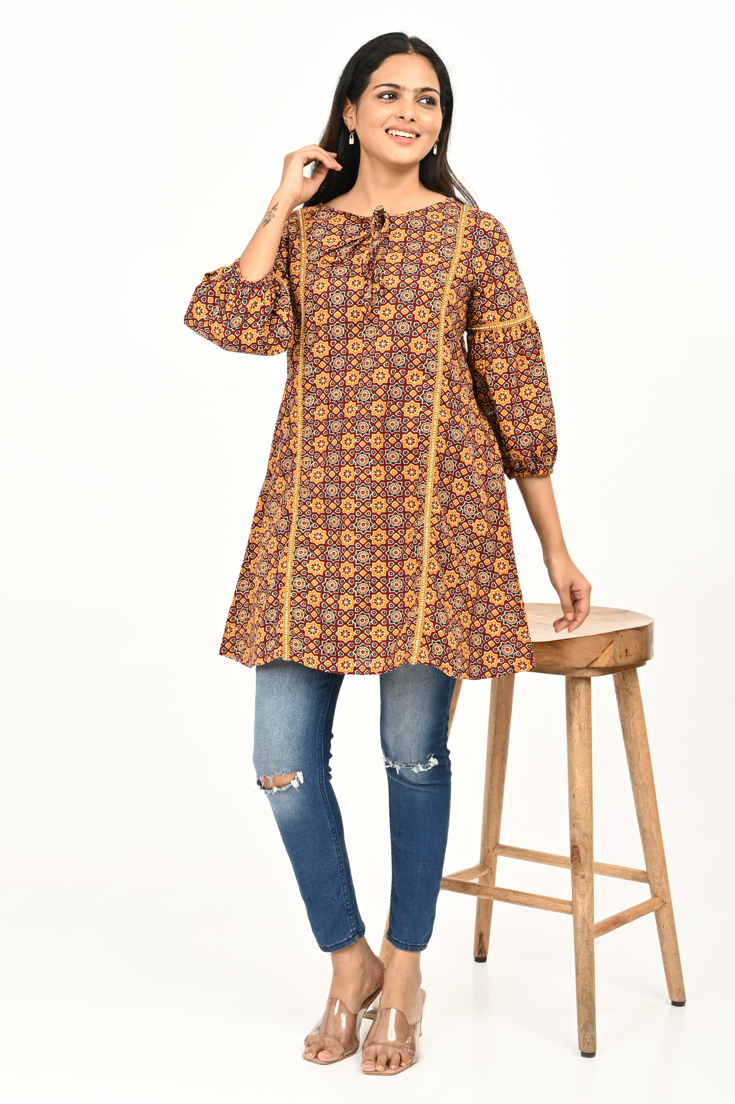 Woman wearing rust yellow all-over print 100% cotton tunic top – by Classy Clothing