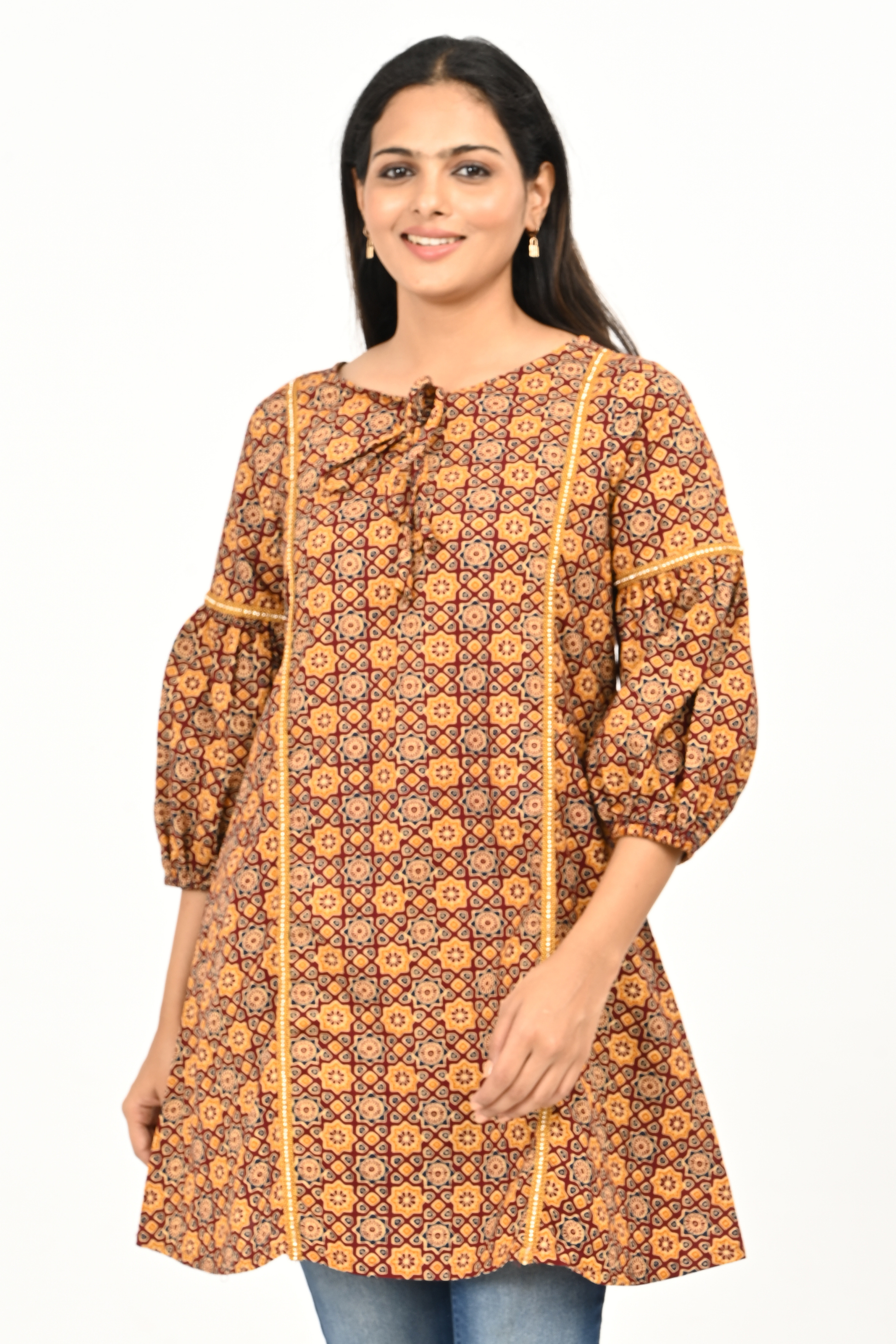 Woman wearing rust yellow all-over print 100% cotton tunic top – by Classy Clothing