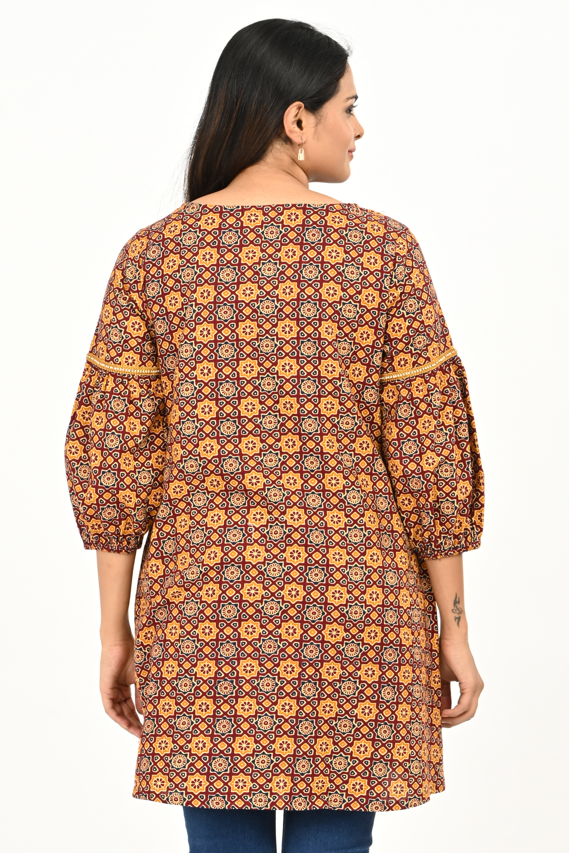 Back view of rust yellow all-over print 100% cotton tunic top for women