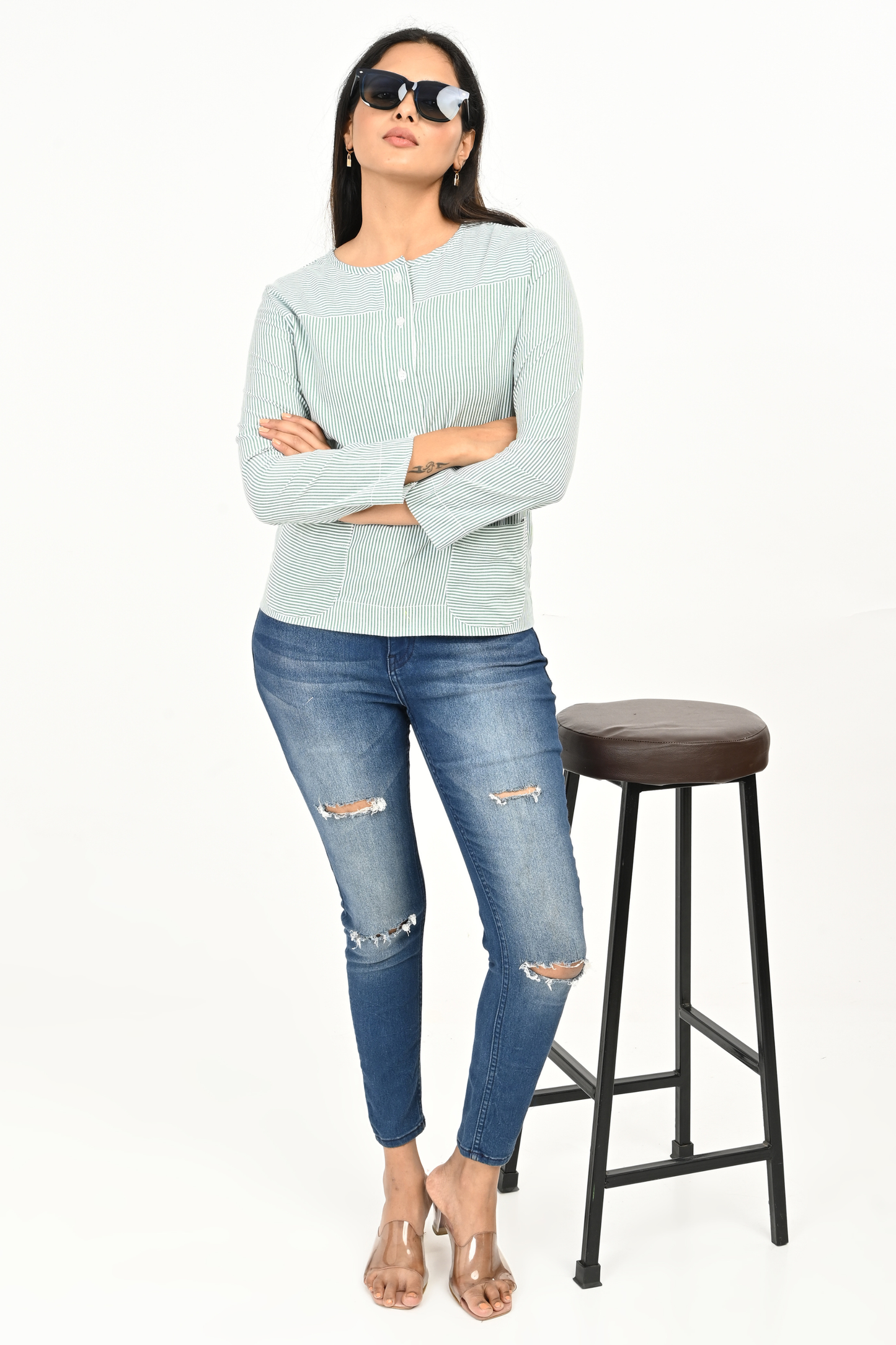Woman wearing mint green & white striped 100% cotton top – front view – comfort fit, hip length.