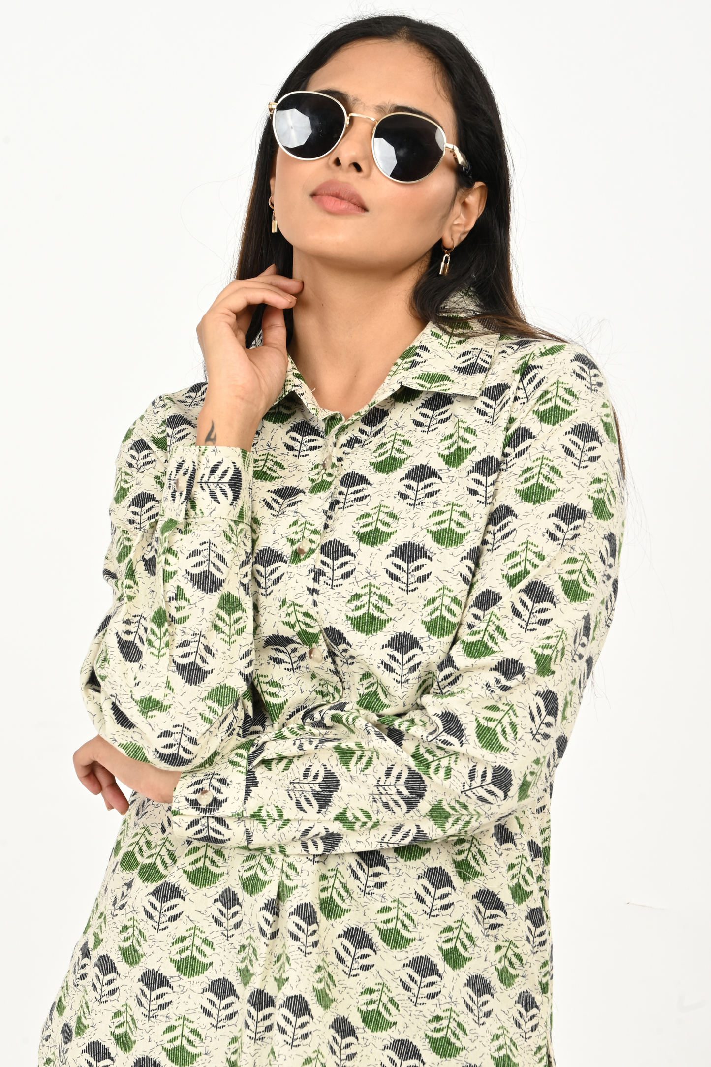 Close-up fabric detail of aqua green AOP cotton top for women