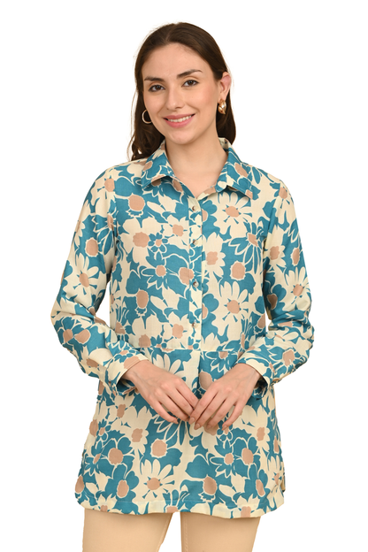 "Close-up of teal and cream floral printed cotton shirt top with collar and buttons"