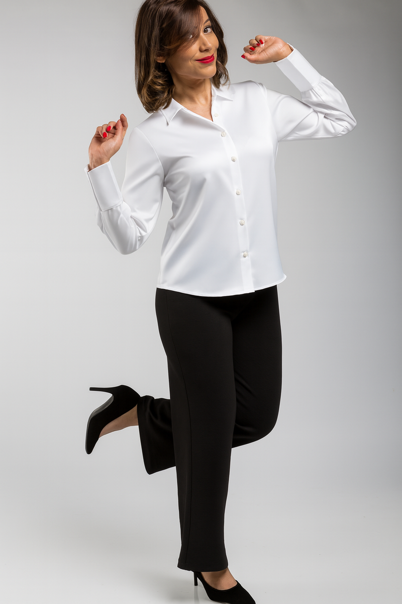 “Woman wearing a white satin shirt styled for office and party wear – studio pose, premium satin fabric.”