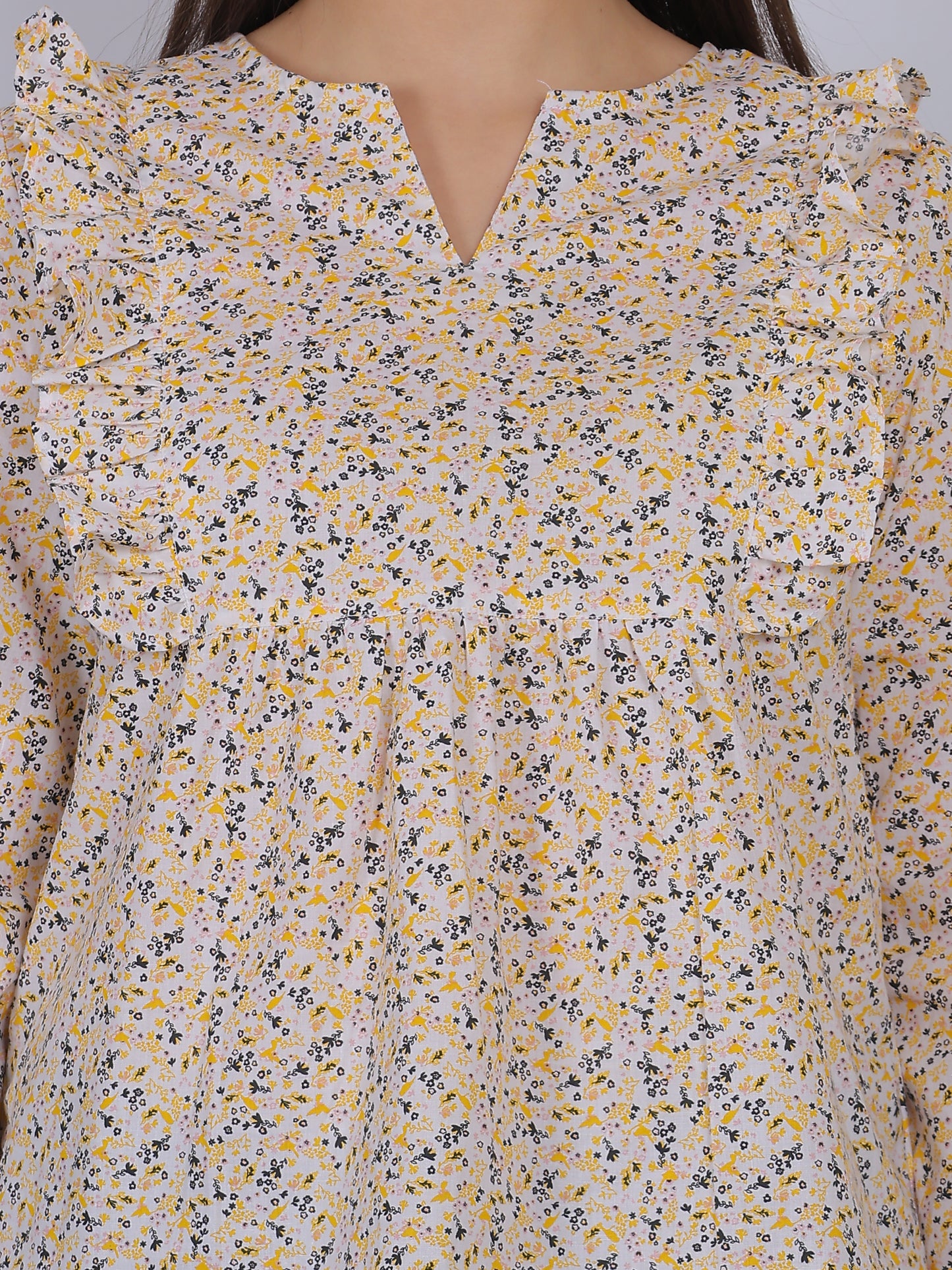 Close-up view of 100% cotton all over printed floral top fabric and neckline design, breathable summer wear for women in India