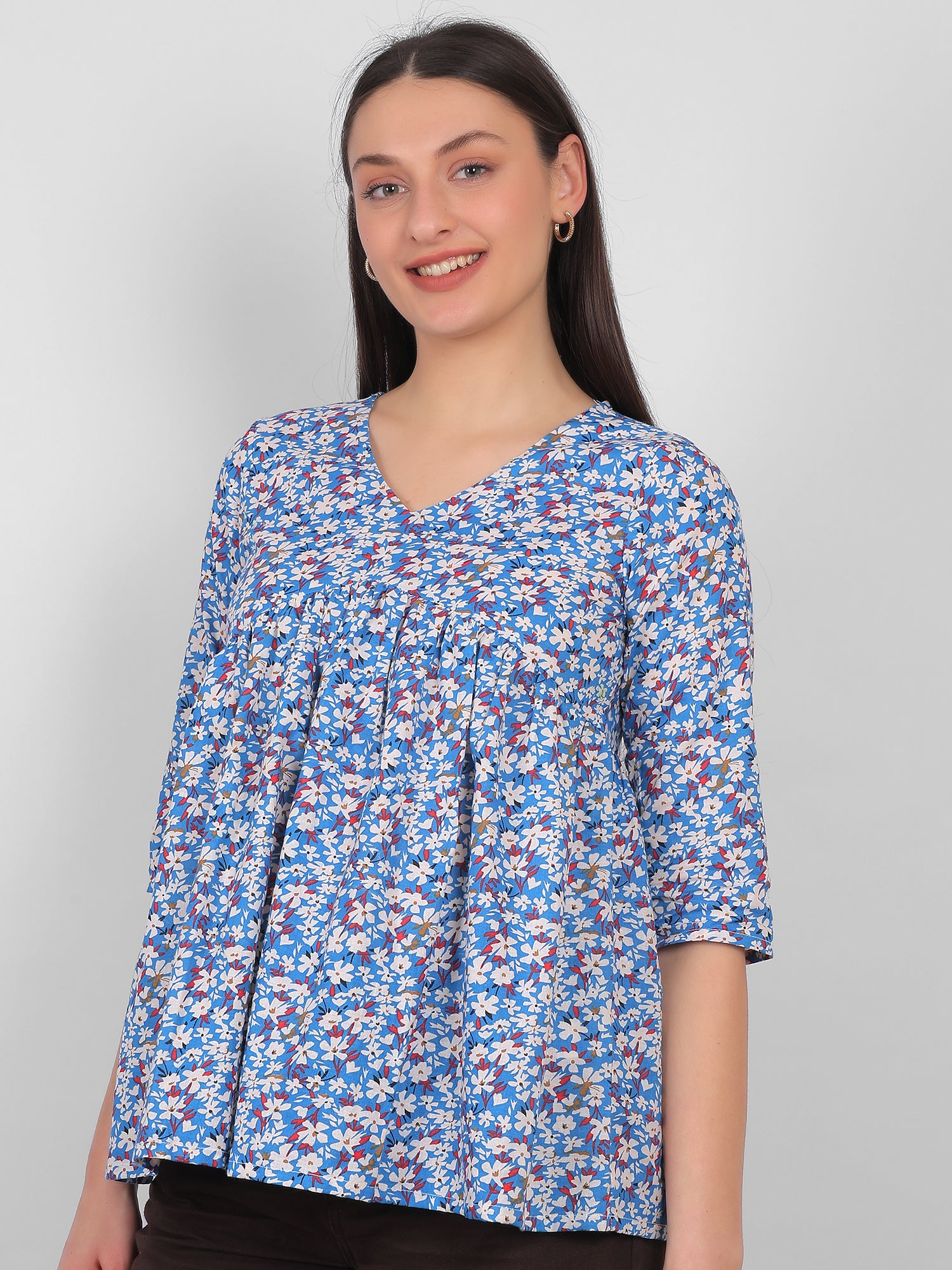 Front view of blue floral printed 100% cotton top for women with V neck and three quarter sleeves, summer wear in India