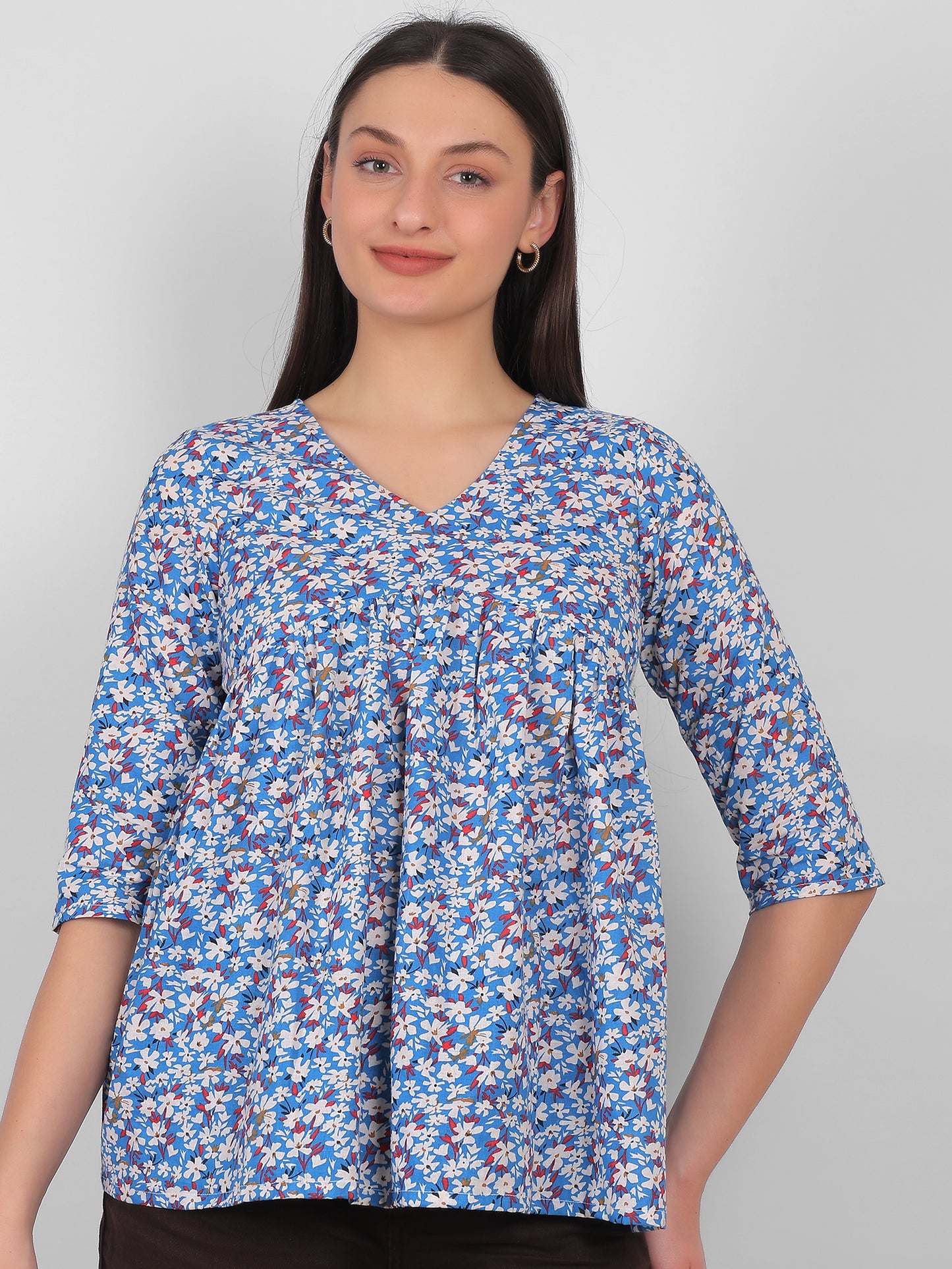 Front facing view of blue floral printed 100% cotton top for women with V neck and three quarter sleeves, summer wear in India