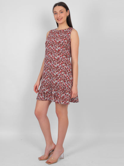 Woman wearing all over printed rayon dress for women in India, side view sleeveless summer dress in lightweight breathable fabric for casual wear