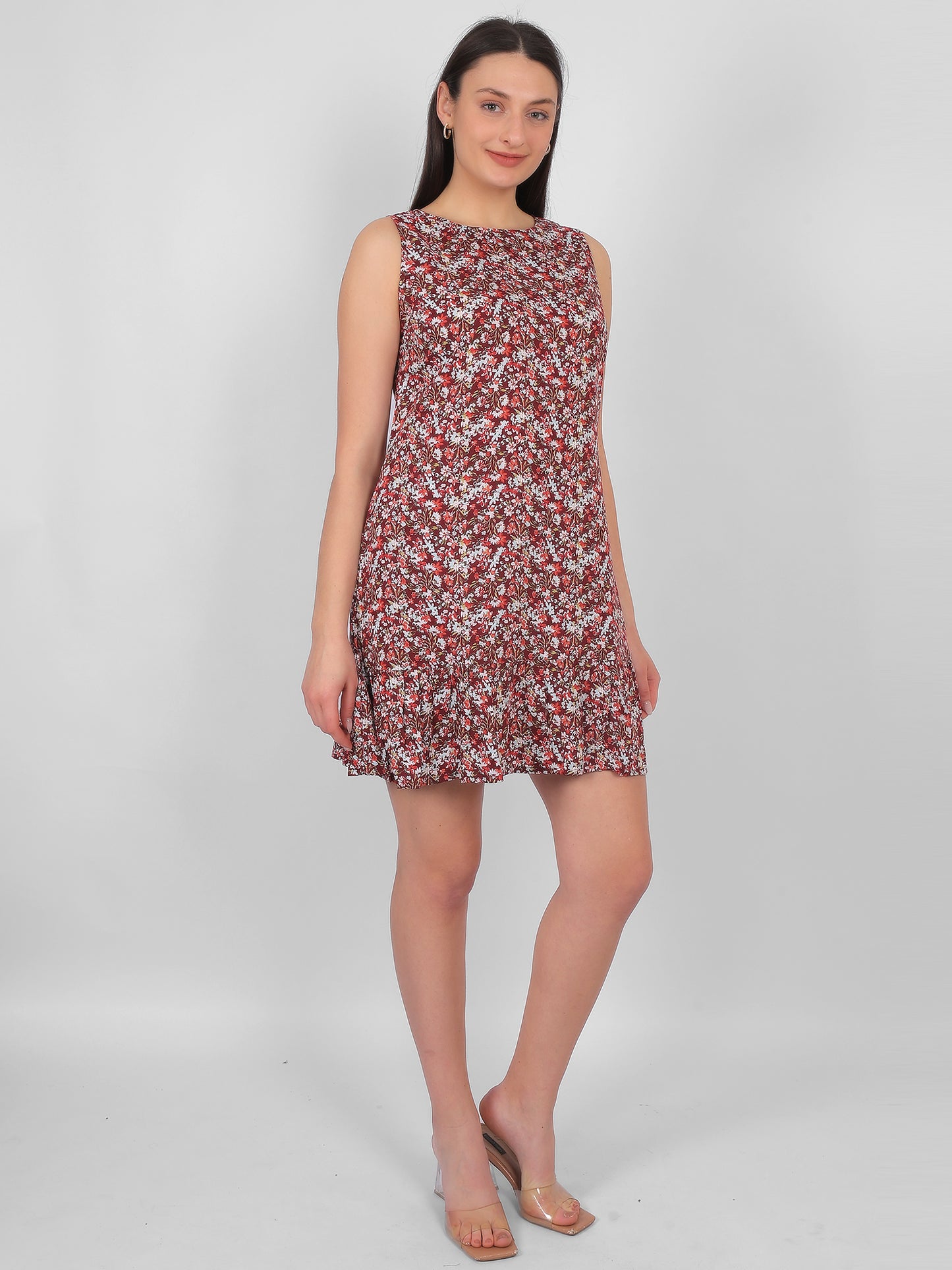 Woman wearing all over printed rayon dress for women in India, front angle sleeveless summer dress in lightweight breathable fabric for daily wear