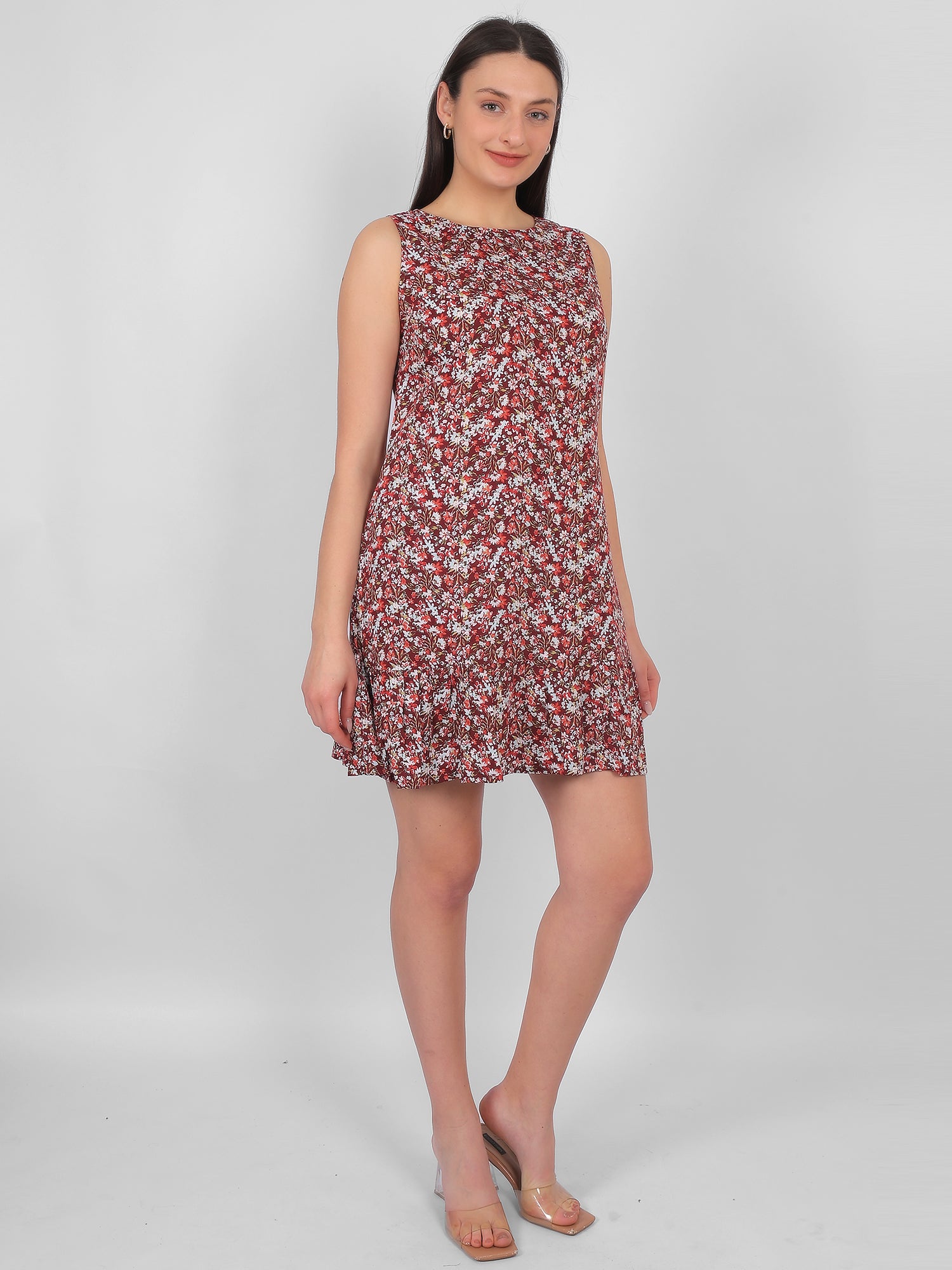 Woman wearing all over printed rayon dress for women in India, front angle sleeveless summer dress in lightweight breathable fabric for daily wear