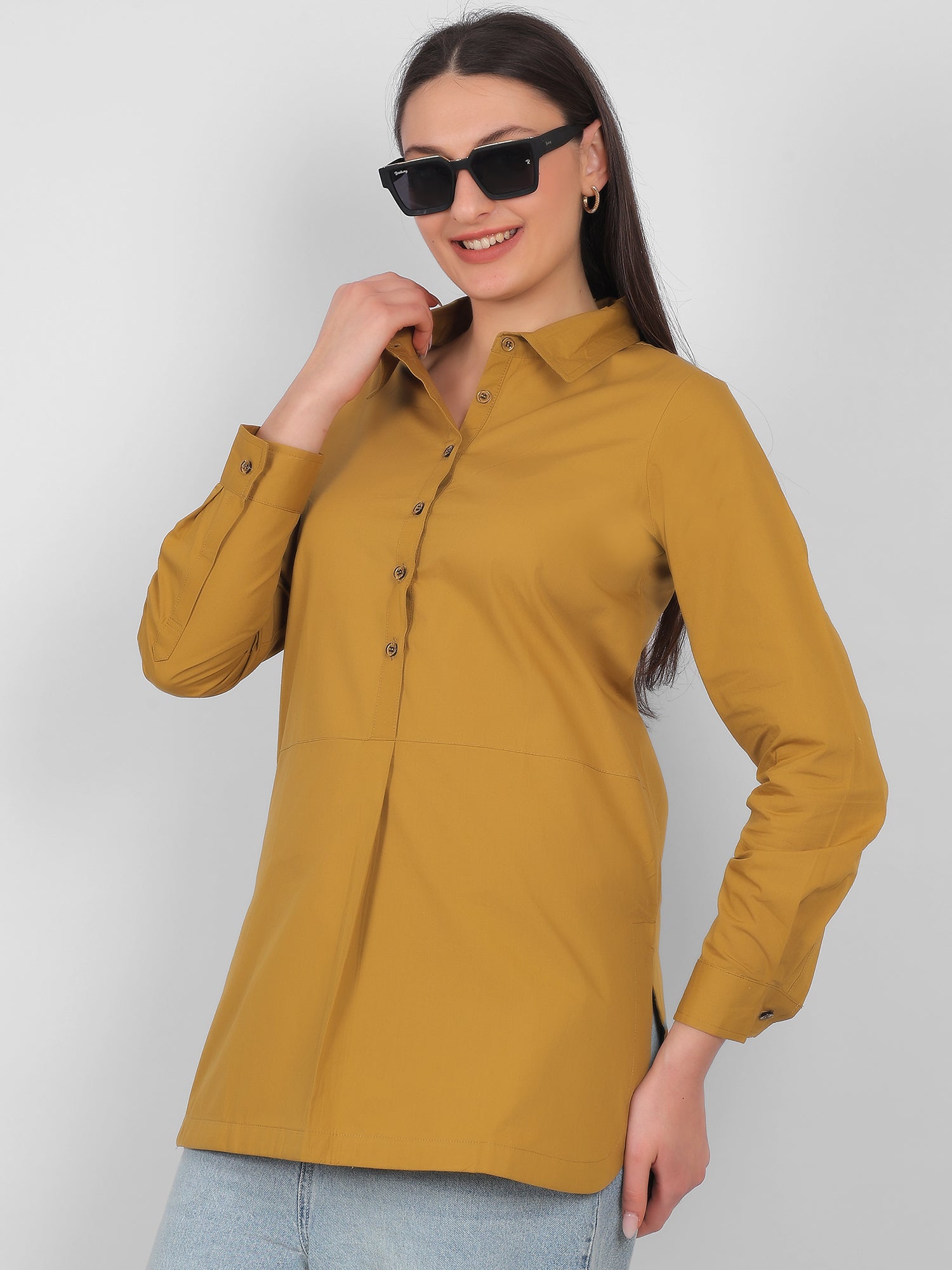 Front angle view of mustard yellow 100% cotton solid long top for women with full sleeves perfect for office wear and casual wear in India