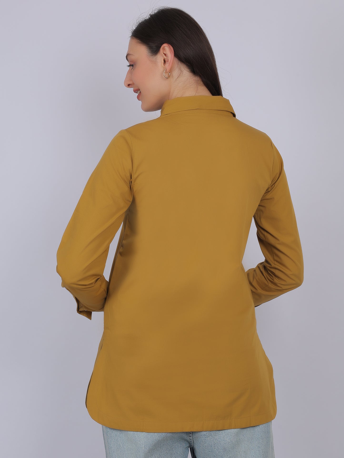 Back view of mustard yellow 100% cotton solid long top for women with full sleeves showing straight fit and smooth fabric finish ideal for everyday wear in India