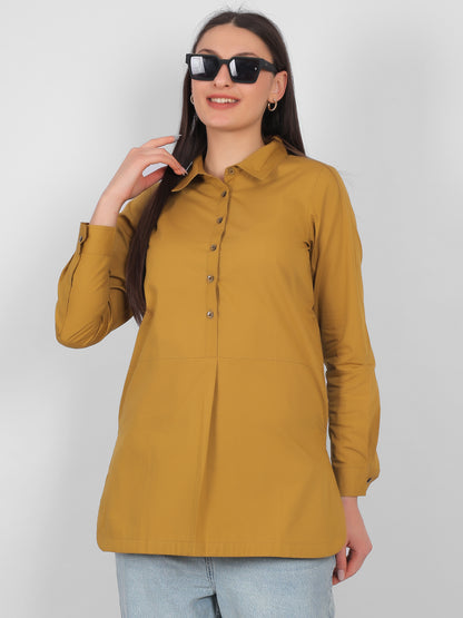 Front full length view of mustard yellow 100% cotton solid long top for women with full sleeves styled with jeans perfect for casual and office wear in India