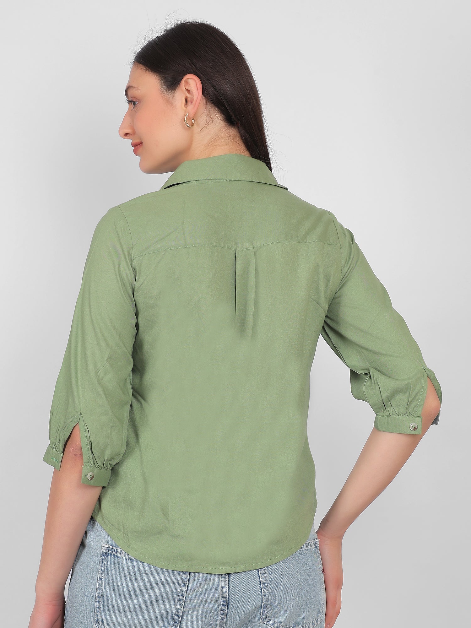 Solid green 100% rayon top for women showing back view with collared neckline and three quarter sleeves, comfortable casual and office wear top for Indian women