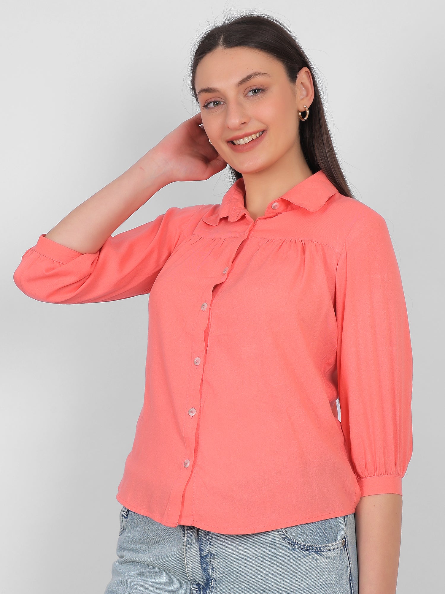 Solid coral pink 100% rayon top for women with collared neckline, front button design and three quarter sleeves, front view casual and office wear top for Indian women