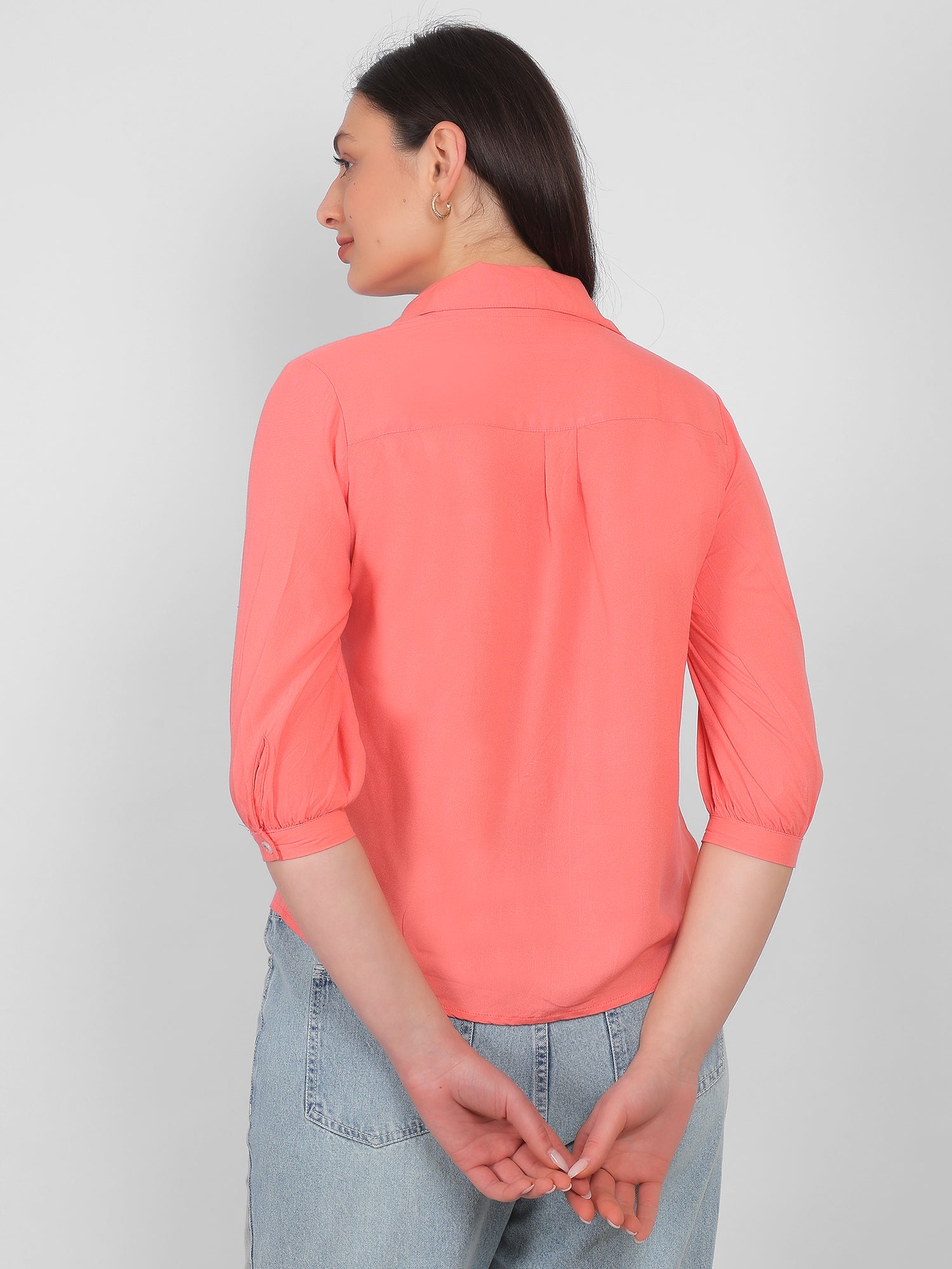 Solid coral pink 100% rayon top for women showing back view with collared neckline and three quarter sleeves, breathable casual and office wear top for Indian women