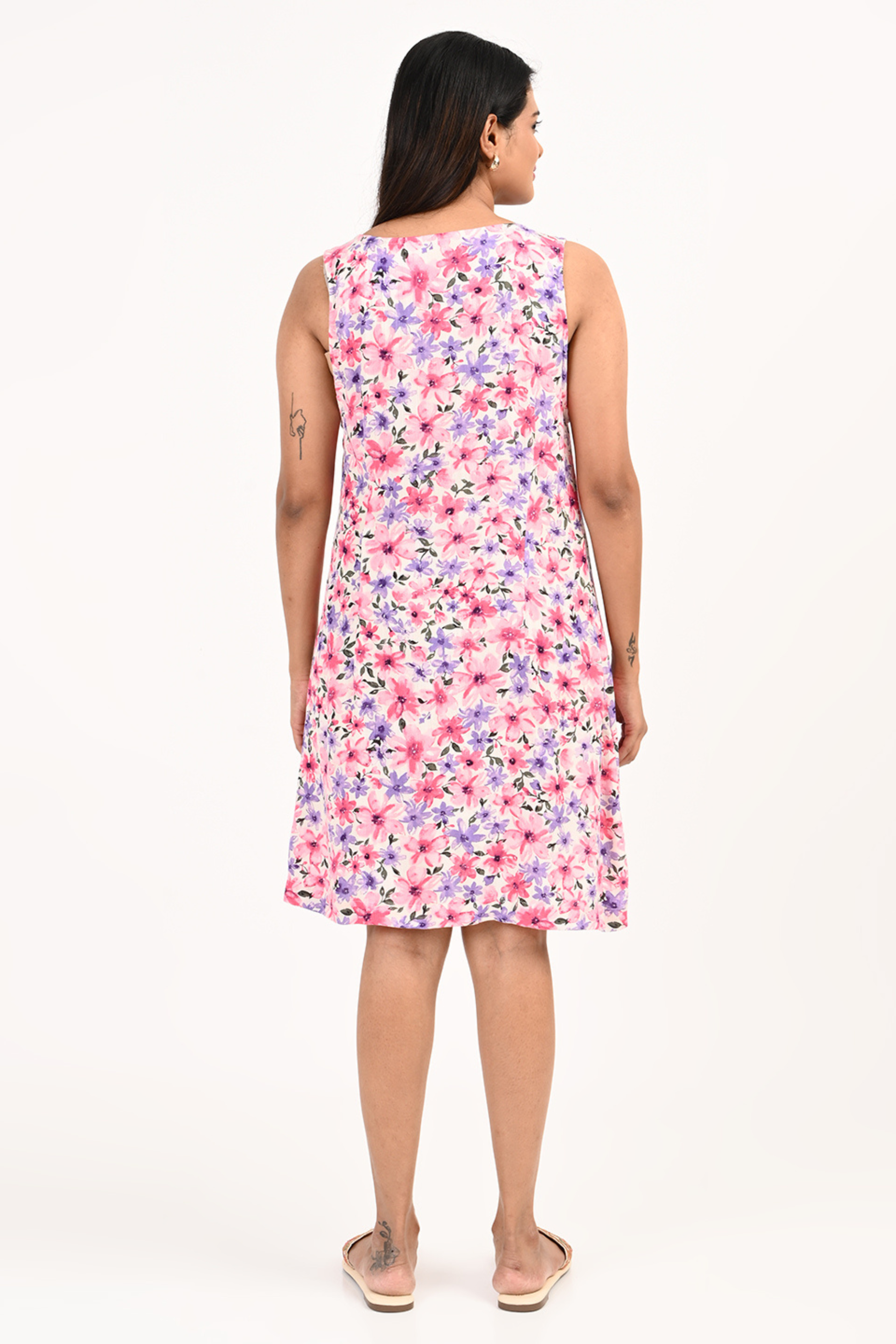 Back view of pink floral rayon dress – elegant and comfortable women’s summer outfit