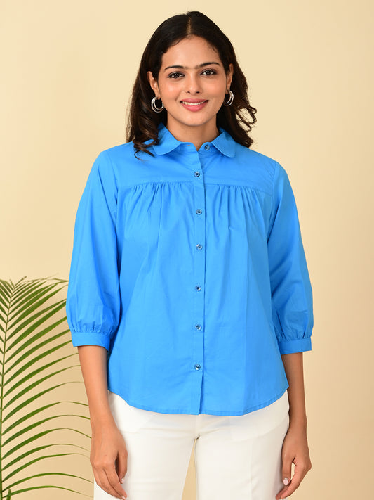 Women's blue cotton shirt with puff 3/4 sleeves and button-down front