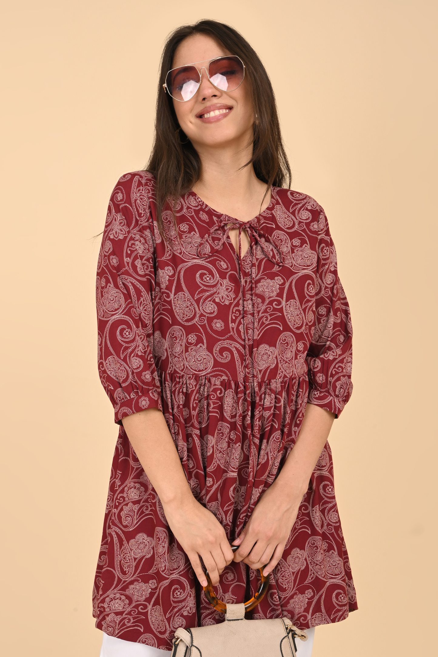 Outfit idea: the maroon paisley rayon tunic styled with white leggings and juttis for a casual Indian wear look.