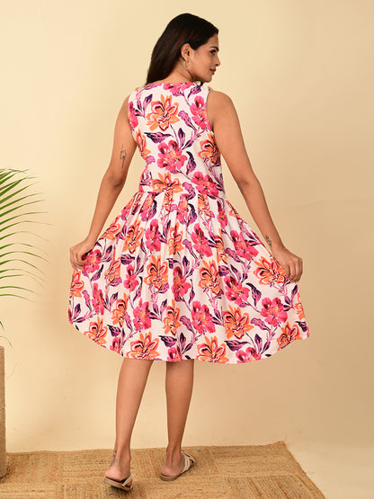 Back view of pink floral AOP rayon sleeveless midi dress for women in India, breathable lightweight rayon fabric, elegant fit and flare casual summer dress for office, travel, brunch and everyday wear.