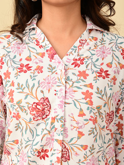 Close-up of a pink floral printed full sleeve women's shirt showing the collared neckline, button placket, and floral fabric detail for women in India by Classy Clothing